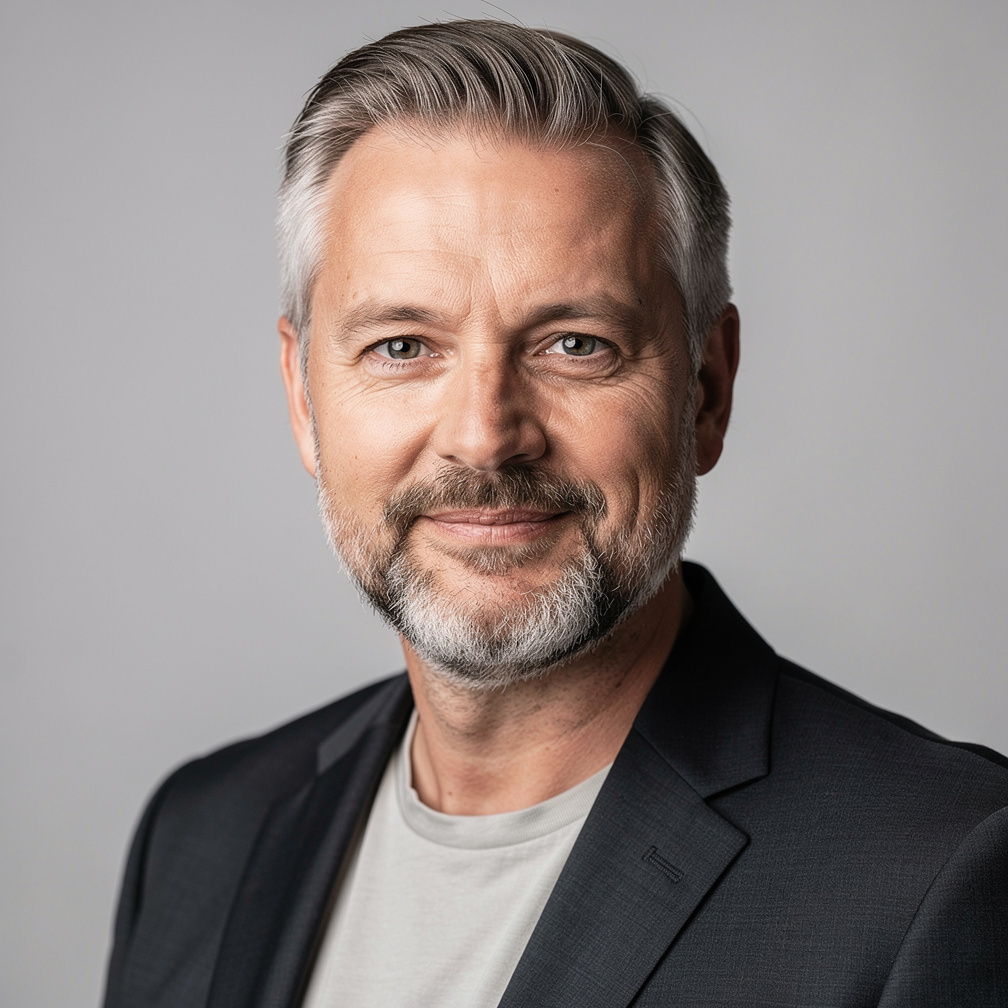 Professional portrait of a German male survey methodologist
